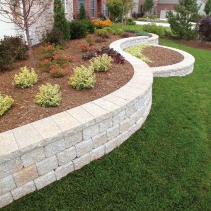 Beautifully manicured lawn with a stone walkway and lush greenery.